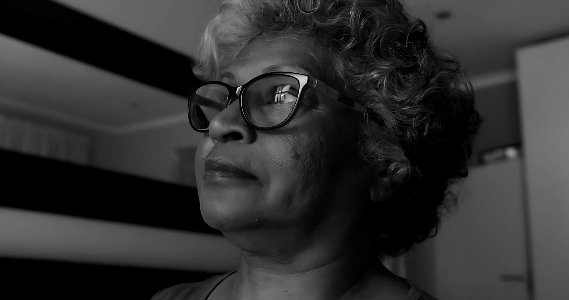 Care assistant helping elderly person with daily activities in their home environment